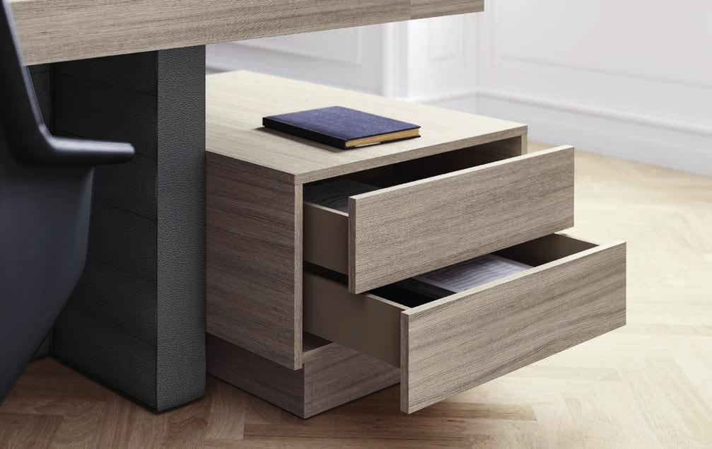 Wood and leather characterise the structural elements, creating a clear distinction from the working surfaces.
