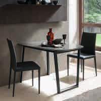 Metal frame dining table with telescopic extending mechanism, top in melamine, wood, ceramic or mortar-look. One folded extension.