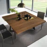 Extending dining table with telescopic mechanism, metal frame, top in melamine, wood or mortar-look, inside folded extension.