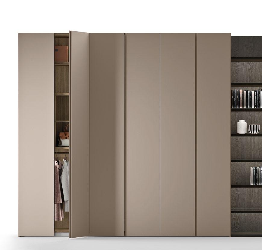 Swing door wardrobe featuring doors with a panel available in matt lacquer with a concave full length integrated handle. The handle is available on a single door or on both.