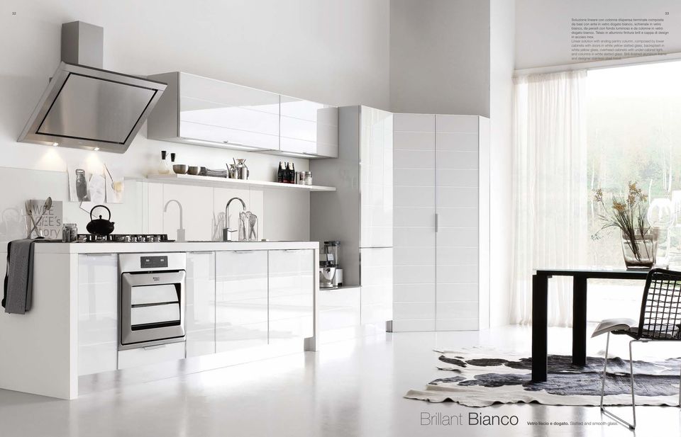 Linear solution with ending pantry column, composed by lower cabinets with doors in white yellow slatted glass, backsplash in white yellow glass, overhead