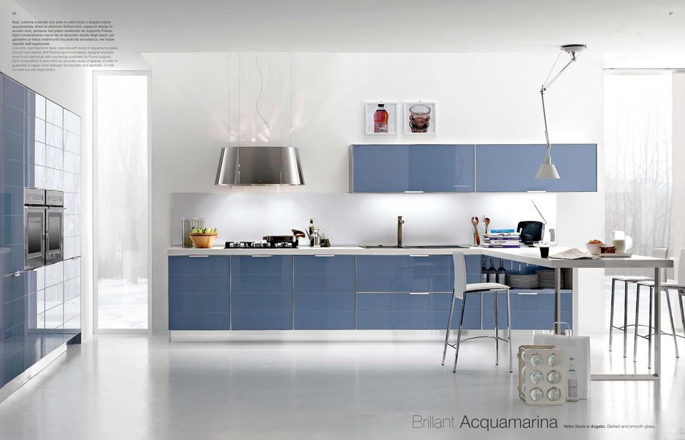 Columns, overhead and lower cabinets with doors in aquamarine glass, smooth and slatted; Brill-finished aluminum frame; designer stainless steel hood; peninsula with countertop sustained by Frame