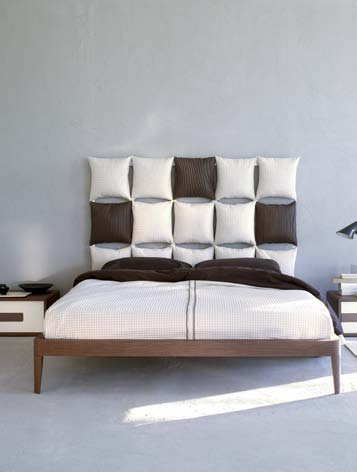 A beautiful combination of a Pixel cushioned headboard with a Light bed surround in canaletto walnut.