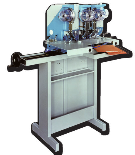 Pneumatic riveting / eyeleting machine with 4 heads. The machine fix four eyelets or rivets at one stroke at a adjustable distance.