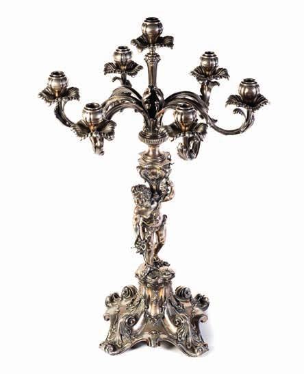 219 219 Candelabro in argento, Italia XX Secolo raffigurante putto, a sei bracci.