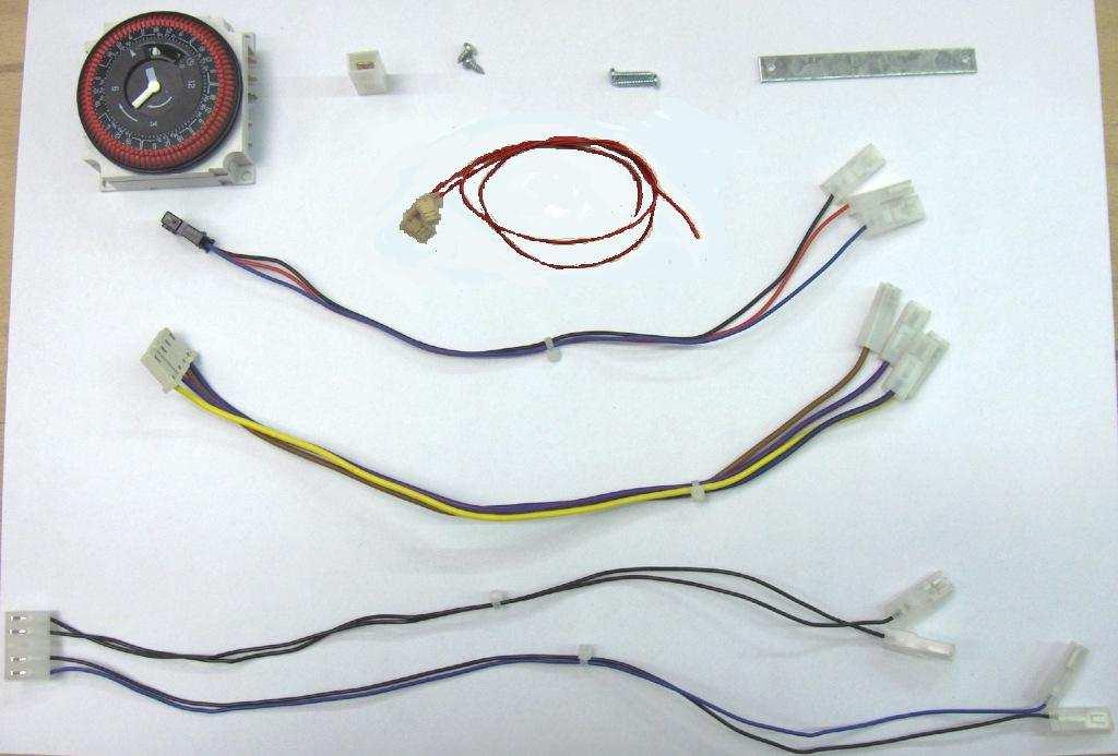 1. ISTRUZIOI PER ISTAATORE 1.1. COMPOSIZIOE DE KIT. Il kit timer è raffigurato in figura ed è composto da una scheda elettronica con 4 cablaggi, 2 viti, 1 adattatore per faston, 1 staffetta, 1 timer.