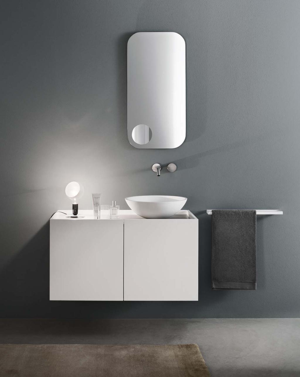 TENDER Design Marco Taietta Tender è un mobile lavabo di dimensioni contenute, caratterizzato dal particolare risvolto dell anta e dalla sua sporgenza rispetto al filo top che ne consente l apertura.