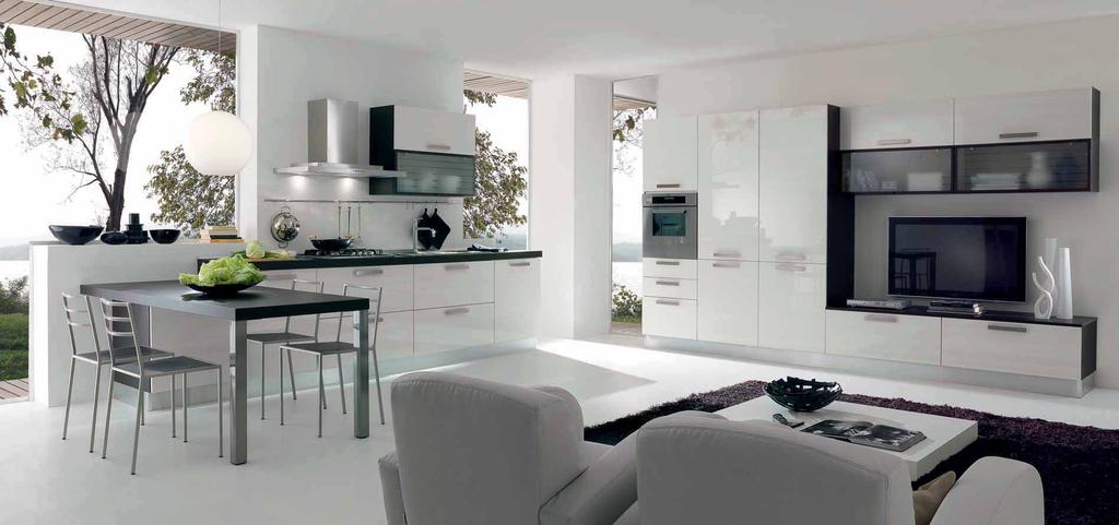 34 35 BIANCO FRASSINATO LUCIDO E ROVERE MORO. LA SOLUZIONE LIVING SI INTEGRA CON LA CUCINA.