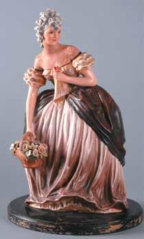 Italia, sec. XVIII. cm33x27 12-312 89 Statuina in ceramica dipinta raffigurante gentildonna con cesto di fiori, su base in legno ebanizzato, firma illeggibile sul retro. Alt.