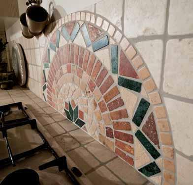A mosaic decorates the tiled splashback