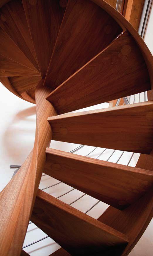 Wooden spiral staircase with helical pole, helical