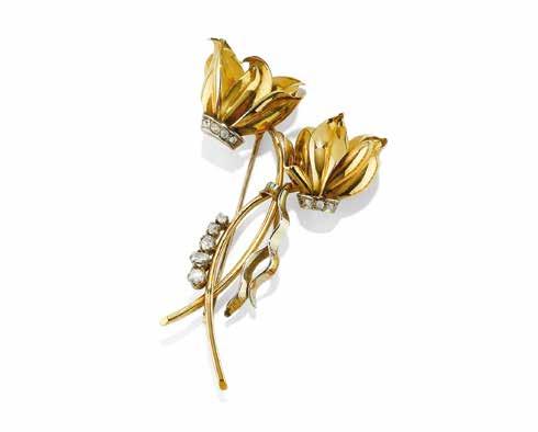 Circa 1950. Gr 22,60 - cm 8,00 x 4,50 DIAMOND CYCLAMEN BROOCH in bicolored gold depicting two cyclamens with rose-cut diamonds. Circa 1950.