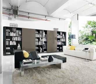 SESTANTE table in walnut wood with Emperador dark marble top, matched with SESTANTE armchairs covered in hard leather.