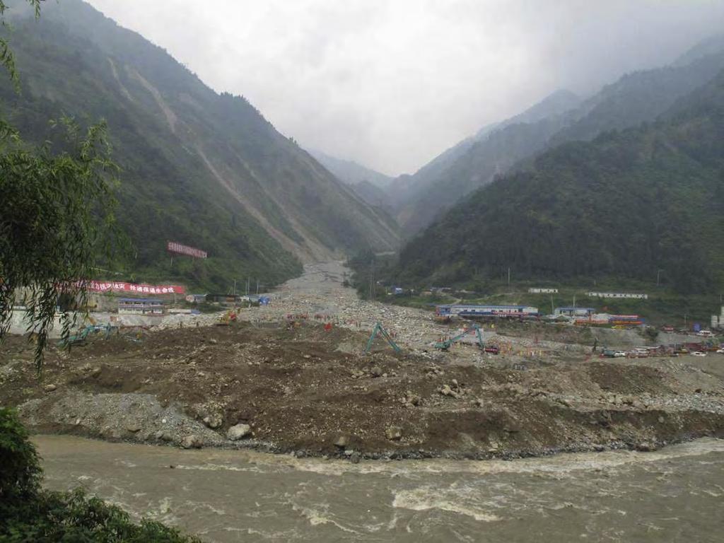 Postseismic debris flows fan driven by heavy rainfall in