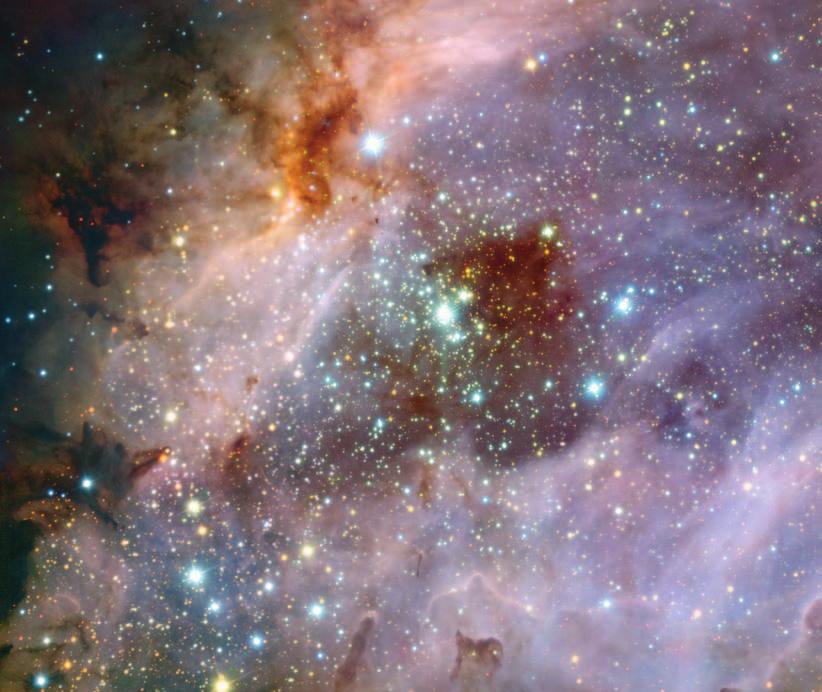 Sotto, le enormi nubi di gas e polveri della nebulosa Messier 17 catturate nell infrarosso vicino dal VLT.