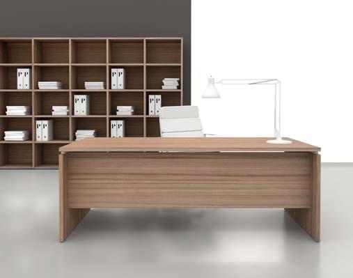 The large walnut version desk defines the semi-executive space with elegance and functionality. The same finishing Profcase open cabinet organizes the background wall.