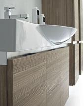 THE DEEPNESS OF THE LARGE DRAWER REGULATED BY SLIDING, EASILY MOVABLE GUIDES AND FALL STOP RAILS, MAKES IT AN ALL-PURPOSE STORAGE UNIT. THE SHAPE OF THE WASH BASIN IS PLEASANTLY DYNAMIC.