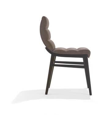 Chair with back upholstered in front and wood at sight on the