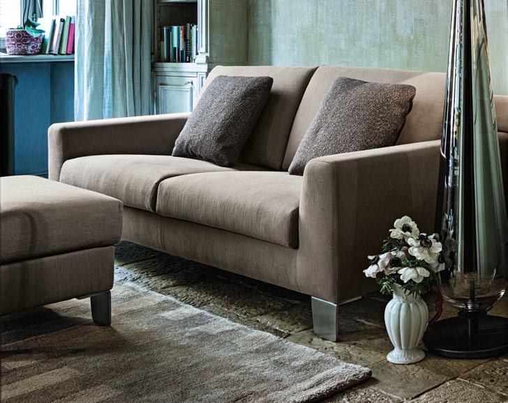 EASY Design Adriano Piazzesi 2000 Composition C with headrest rolls and pouf in fabric D/4260 collection Ciré, feet M6. Cushions in fabrics D/4180 collection Jaipo and D/4183 collection Gange.