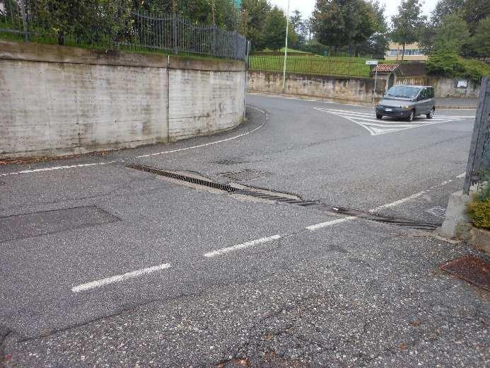 fresatura asfalto per larghezza cm 50 intorno alla griglia lato verso valle e di cm 200 lato verso monte e fino al muro di