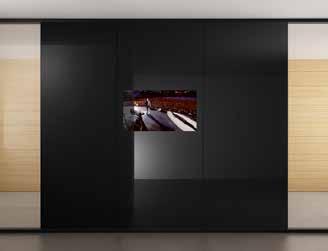 Vetroin customizes Evolvinwall, making it a technological storage, transforming it into Mirror Images, a multimedia partition wall in which thickness a monitor is