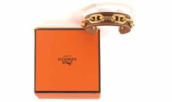 IL PONTE CASA D ASTE 228 229 1927 1927 HERMES Bracciale alla schiava in pelle color nocciola e catena color oro, con scatola originale