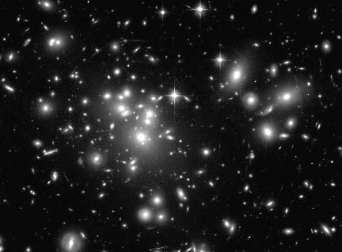 Un ammasso di galassie appare così: ognuno di questi batuffoli luminosi è una