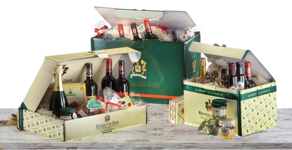 Le scatole ed il paniere 16) SCATOLA GOURMET (n 9 prodotti) 55,620 + IVA - 65,10 IVA COMPRESA - Garda Chardonnay - Torrone artigianale 100 gr - Ciambelline al vino Groppello 300 gr - Coroncine di