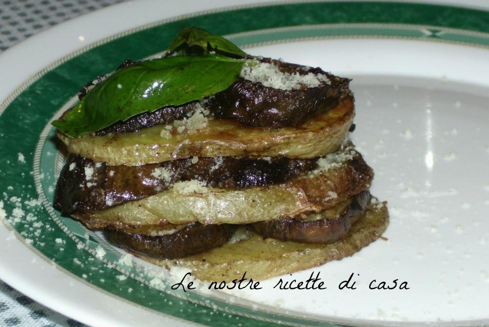 Torretta di patate e melanzane INGREDIENTI x 2 persone 2 patate 1 melanzana lunga sale un cucchiaio di grana grattugiato qualche foglia di basilico 2 cucchiai di olio extravergine di oliva Ho lavato