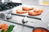 CombiSet Caratteristiche di prodotto Wok a induzione La padella wok Miele si appoggia in un apposita conca affinché il calore si distribuisca in