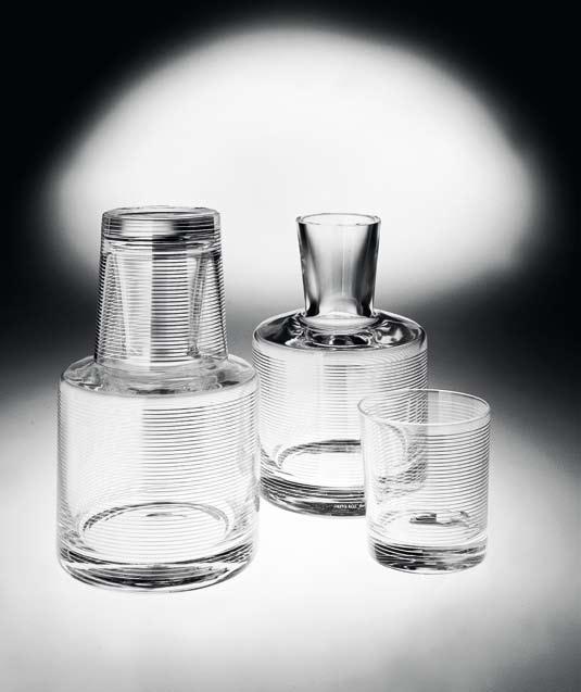SU Defne Koz, 1998 Servito da notte composto da bottiglia e bicchiere in vetro trasparente soffiato a bocca. Decorazione eseguita in serigrafia manuale con Argento 980/1000. Doppia cottura a 540.