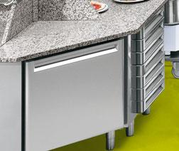 drawers on feet or castors, granite tops.