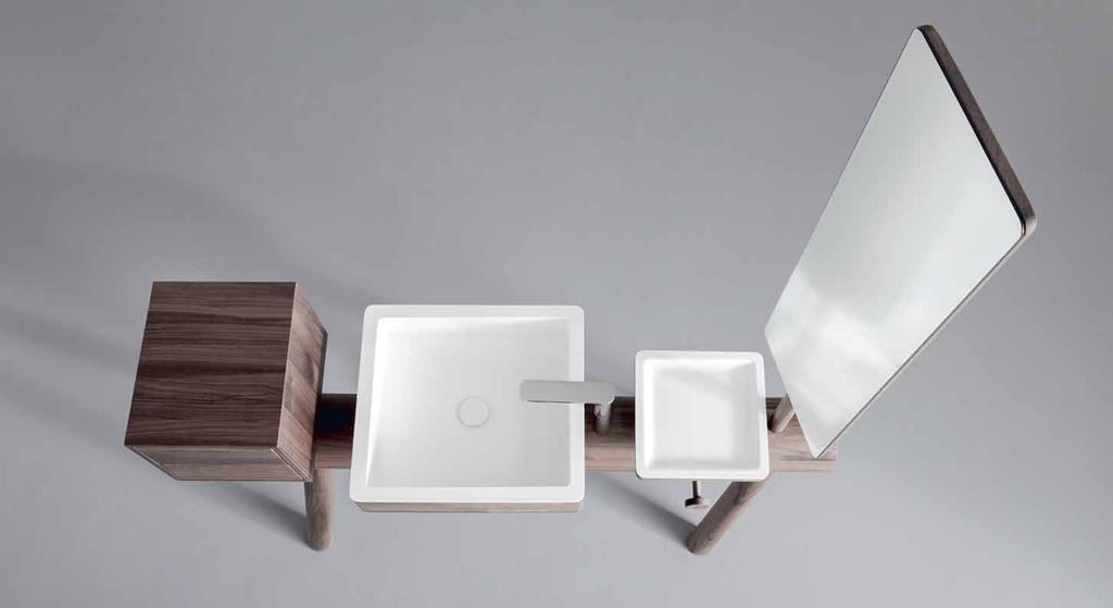 CLEAR-CUT VOLUMES ARE FOUNTS OF EMOTION Basin and Tray in Solid Wood with Canaletto Walnut
