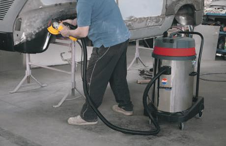 debris created during the operation of the power tool is vacuumed and carried to the tank through the