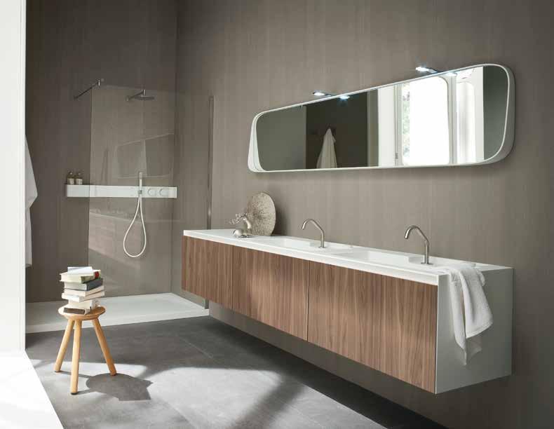 Furniture realized in Corian, with integrated washbasin top and space for the integrated faucet Ergo_nomic with Corian knobs.