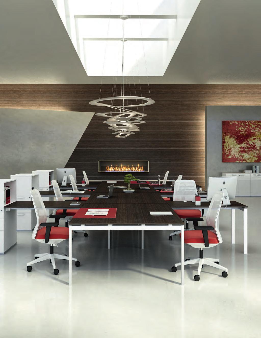 The individual desk has the option of a melamine white frontal panel, extension tables and the new paneled leg.