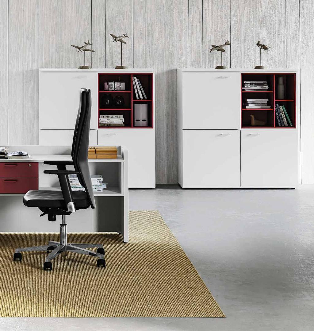 Executive desk entirely made of wood, with or without extension, characterised by neat and precise lines. A sequence of 35-mm panels the meet but do not touch one another.
