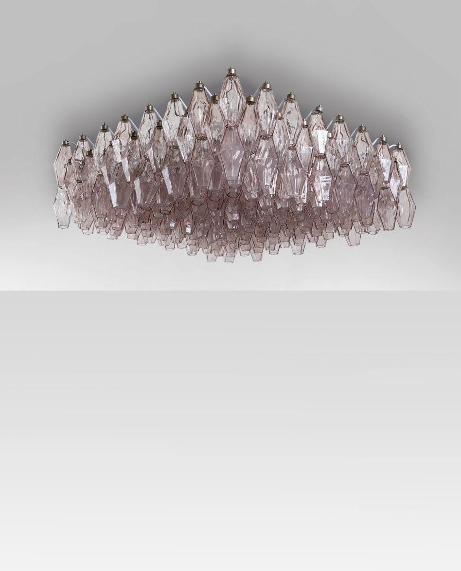 3095 PAOLO VENINI Una lampada a plafone, circa 1960. Acciaio nichelato, vetri 'poliedri' soffiati in stampo. Marca stampigliata sul metallo 'Venini Murano'.