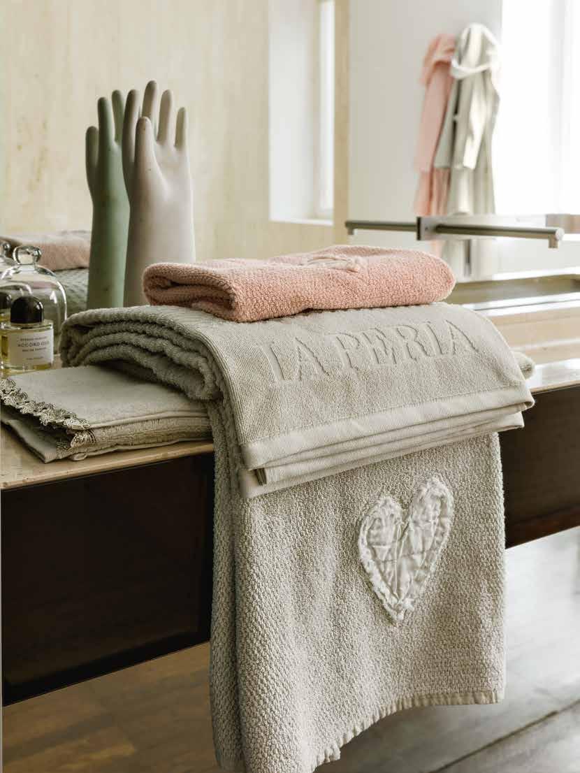 48 THE BATHROOM IS A SOOTHING SANCTUARY WHERE THE SUMPTUOUS SOFTNESS OF LA PERLA TOWELS PAMPERS AND CARESSES YOU AS YOU UNWIND AND RELAX.