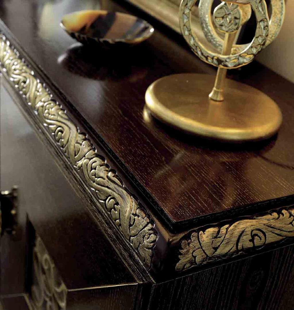 The imposing look of this sideboard is the carved moulding with gold decorations, showing off the