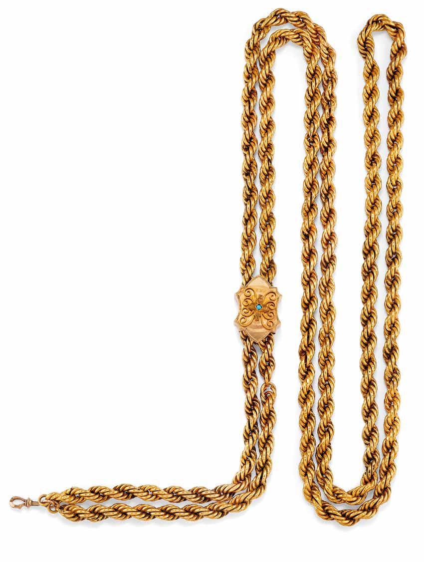 5 5 ANTICA FIBBIA PER CINTURA IN TURCHESI E RUBINI in oro giallo raffigurante due serpenti a contrariè incisi a motivi vegetali con teste impreziosite da turchesi e occhi in rubini. Circa 1850.