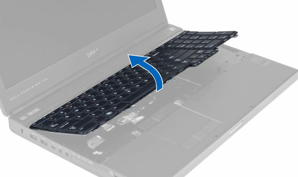 4. Partendo dalla parte inferiore della tastiera, separare la tastiera dal computer e