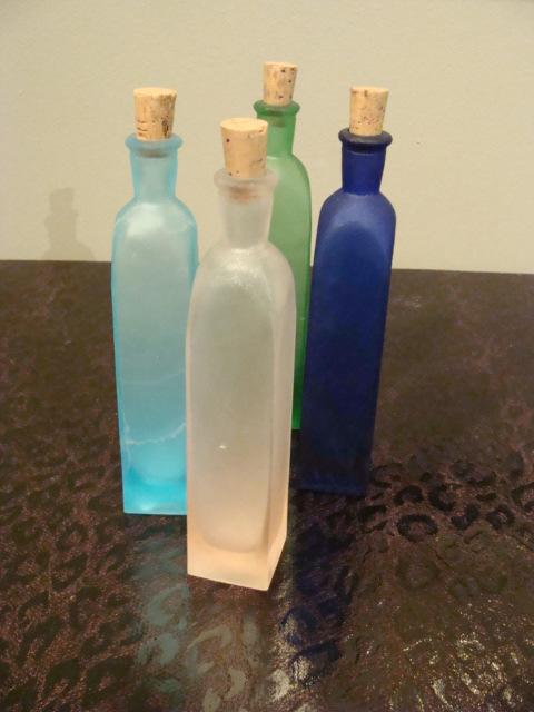 bottiglie in vetro satinato e colorato