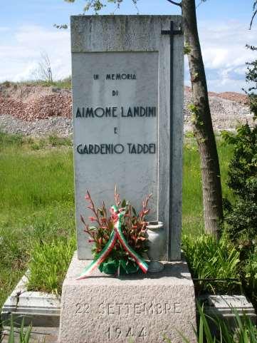 In Memoria di Aimone Landini e Gardenio Taddei Trattasi di una lastra di marmo bianco con epigrafe in bronzo infissa in una base di granito su cui compare l'incisione della data di morte dei due