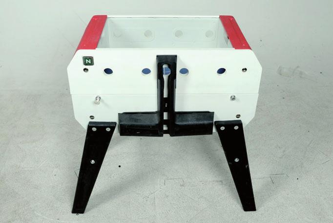 Put the football table body in vertical position as much open as possible to grant a better stability (4).