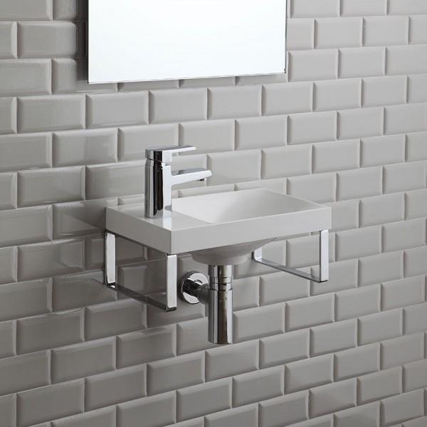 LAVABO SOSPESO CON STAFFE MODELLO STRISCIA CM. 40 02060200000001 Lavabo sospeso in Marmo ricomposto e gel coat completo di staffe in metallo cromato utilizzabili come porta asciugamani.