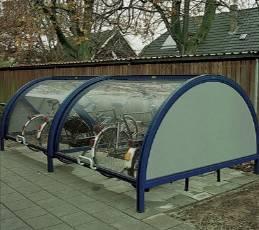 Una cupola per biciclette Bikebox a forma di giostra: le biciclette sono posizionate su una piattaforma girevole; la piattaforma viene ruotata manualmente per posizionare la bicicletta desiderata