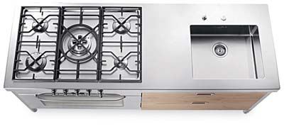 Stainless steel countertop with integrated sink, accessorized inner drawer.