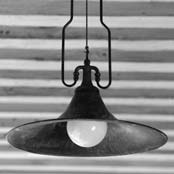 DESCRIPTION: SUSPENSION LAMP FIXED AT PRE-SET HEIGHT WITH ONE LIGHT, WITH CHAIN SUPPORT, AGED-COPPER PLATE, LAMP-HOLDER AND ROSE IN CAST BRASS, SUBSEQUENTLY AGED, AGED-BRASS RACEWAYS.