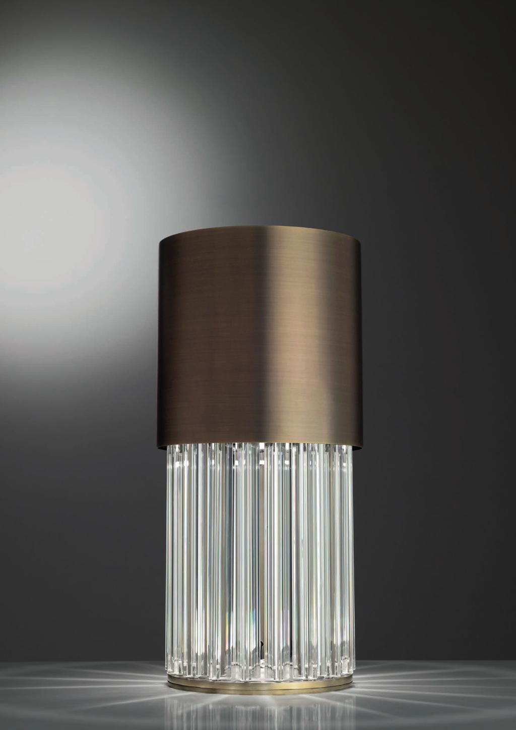 CHIC TABLE 45cm-17 7 Ø 26cm-10 Table lamp with diffuse light. Dark bronze striped structure with crystal, amber or smoke grey trihedrons.